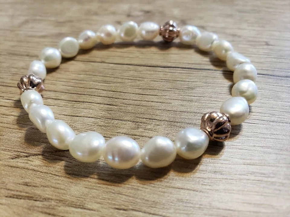 Hand Crafted, All Natural Freshwater Pink Pearl stretch Bracelet with Rose Gold Tone Metal. One size fits most